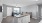 a kitchen with a bar and a couch