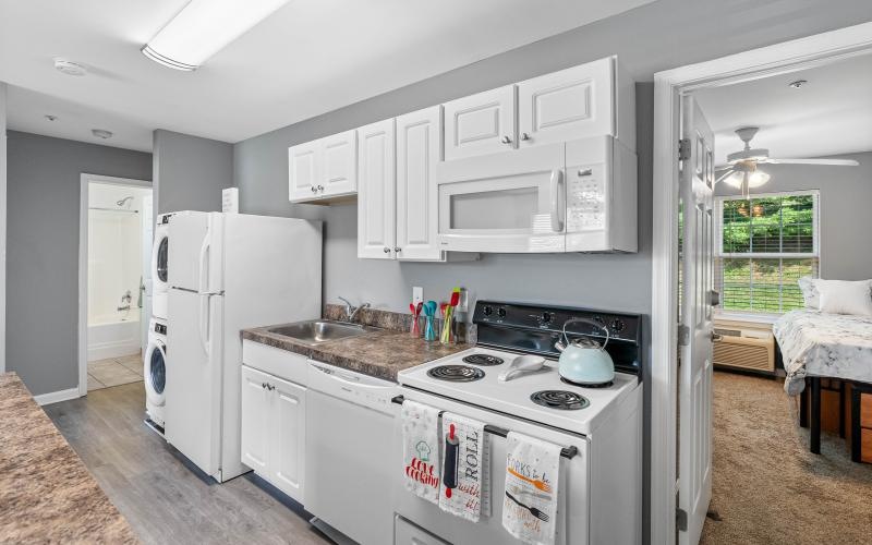 a kitchen with white cabinets