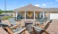 a patio with chairs and tables